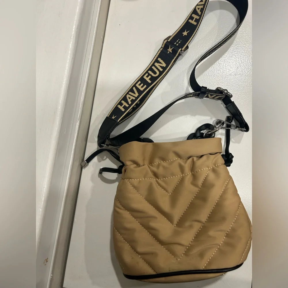 Zara tan quilted crossbody bag with black strap